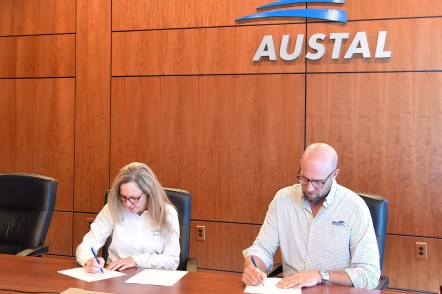 Austal USA President Michelle Kruger and Master Boat Builder President Garrett Rice sign strategic outsourcing agreement to expand U.S. defense shipbuilding capacity